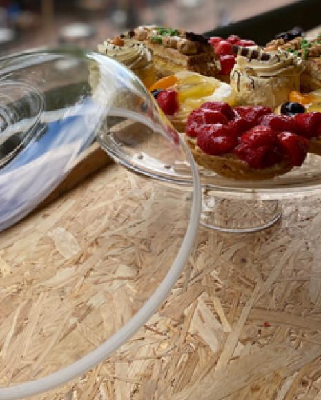 A tiered stand with a variety of pastries.